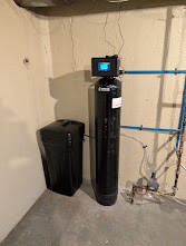 Compact softener installed in a utility room